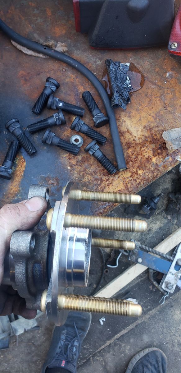Old studs removed, longer studs pressed into the hub