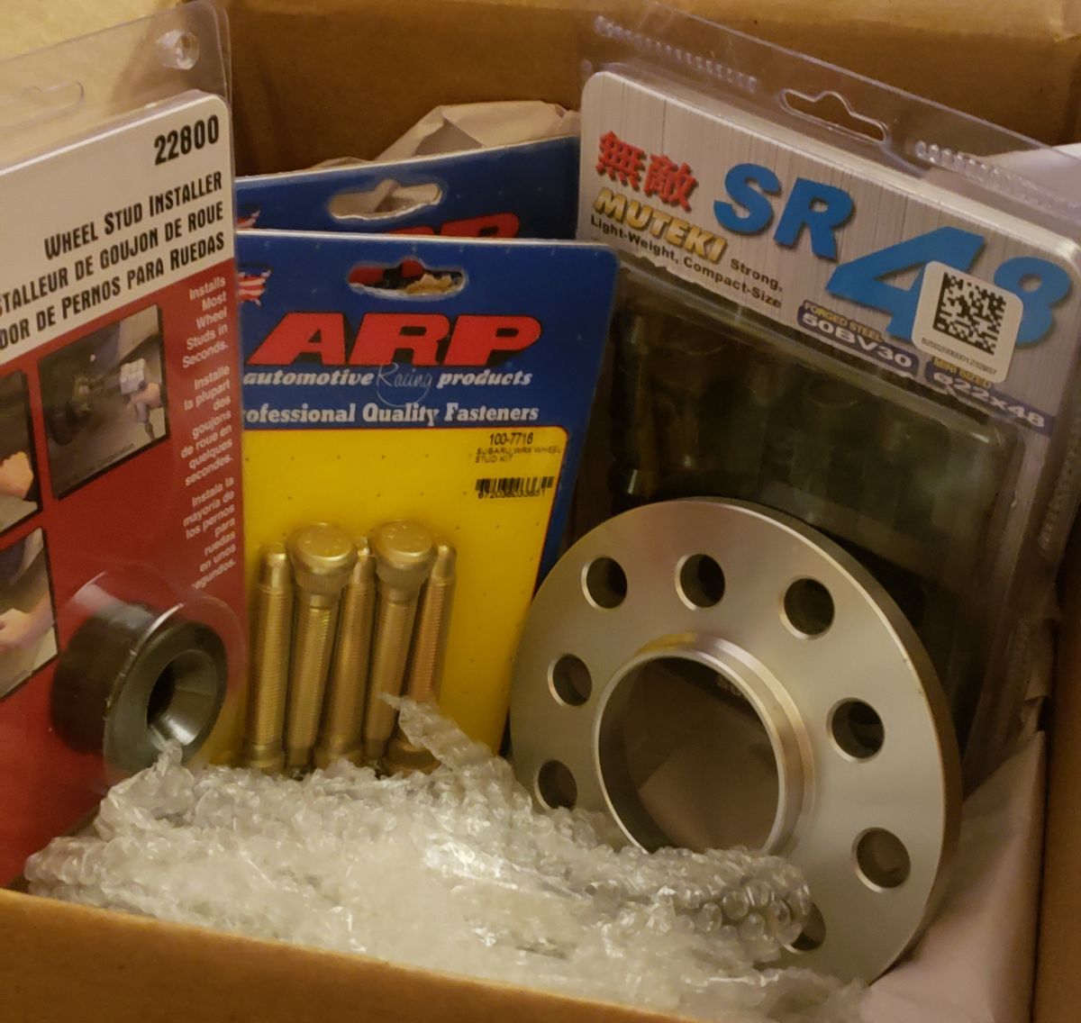 ARP studs, about a 10mm wheel spacer and Muteki SR48 lug nuts