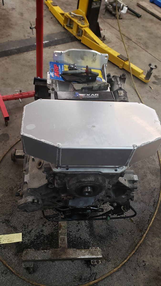 LS on an engine stand with aluminum oil pan and Texas Speed box