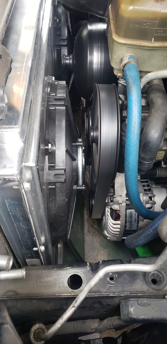 Engine pulleys and electric fan close to the Griffin aluminum radiator