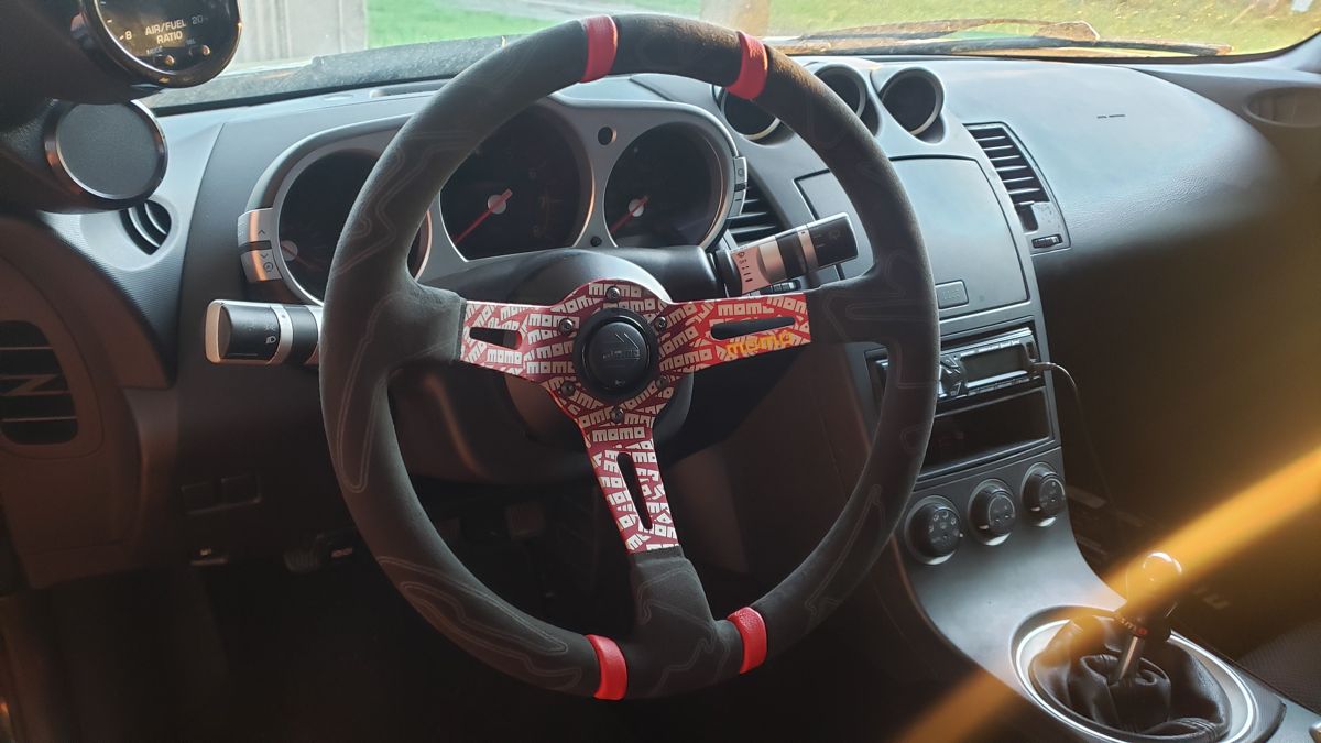 Suede MOMO steering wheel installed in the black 350Z
