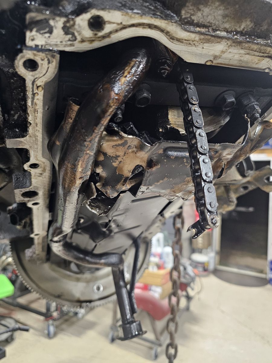 Bent, damaged windage tray and oil pickup under the old 4.8