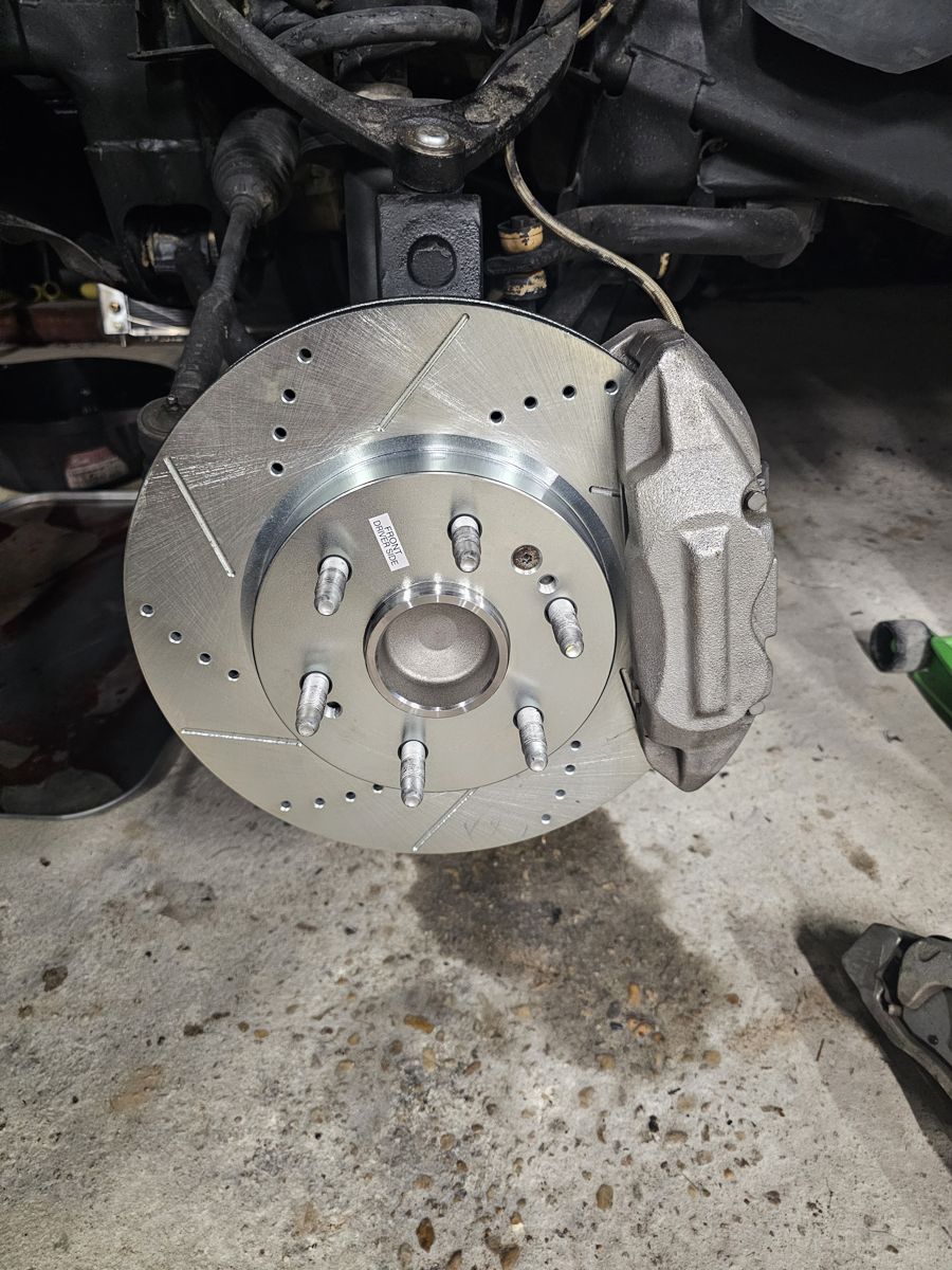 Driver side: caliper and rotor