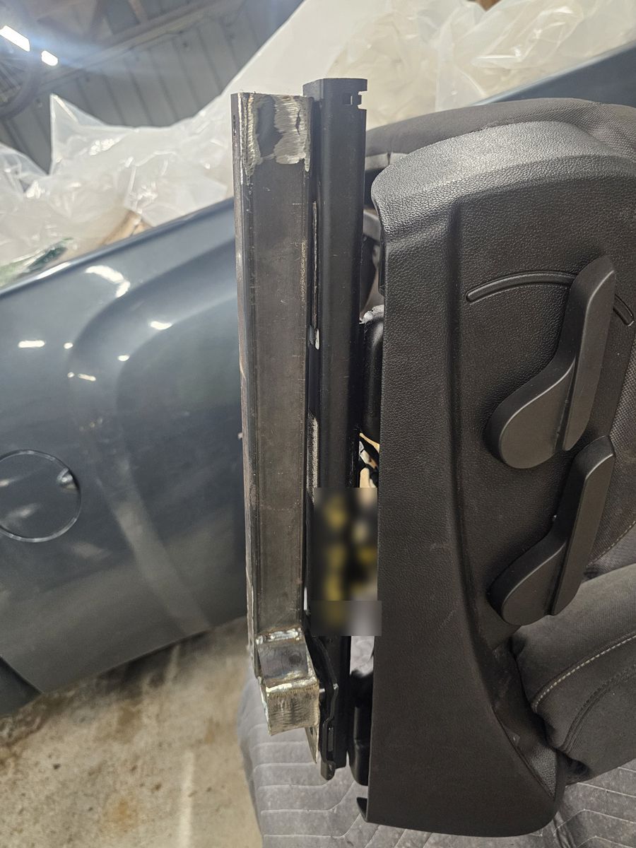 Homemade bracket welded to the seat rail