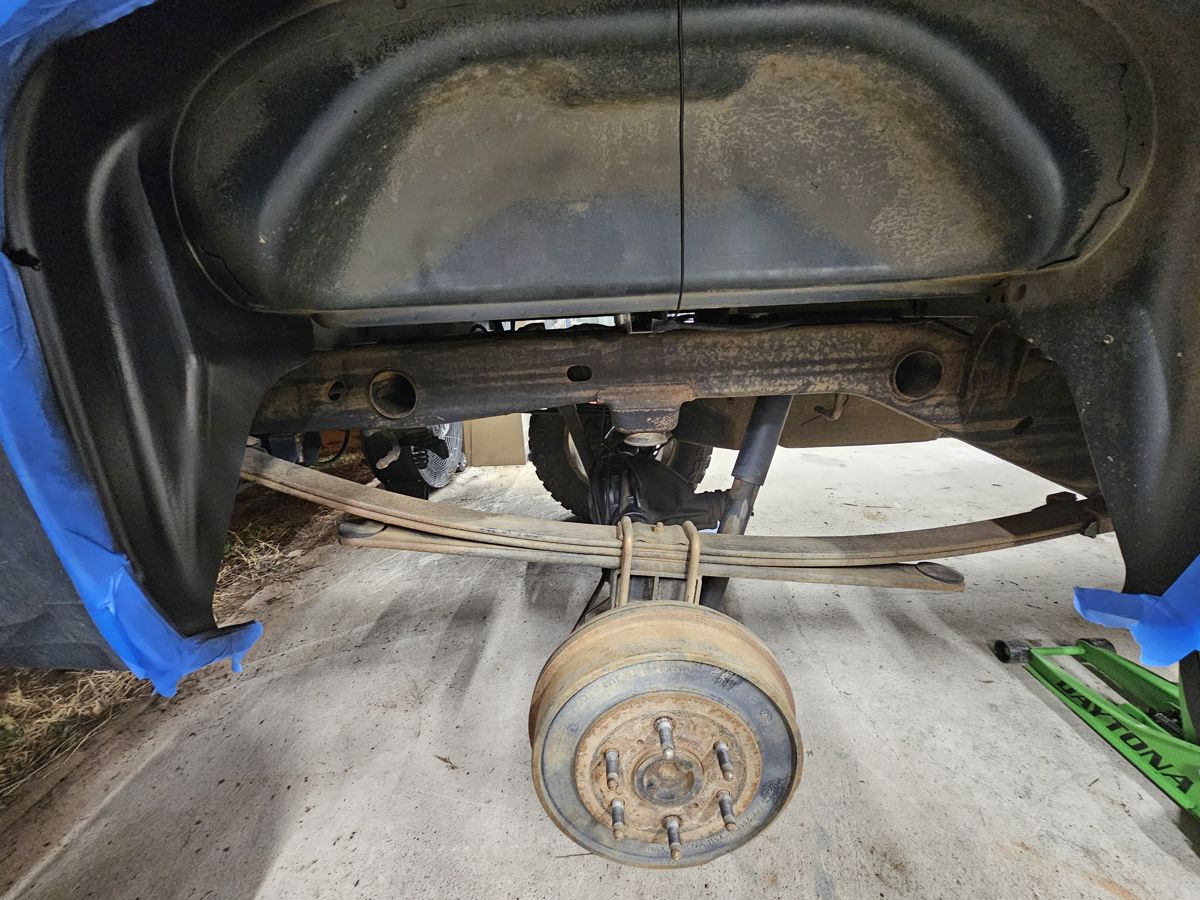 Before: rear wheel well, frame and leaf springs