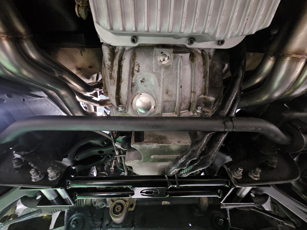 Heat-wrapped cooler lines along the trans