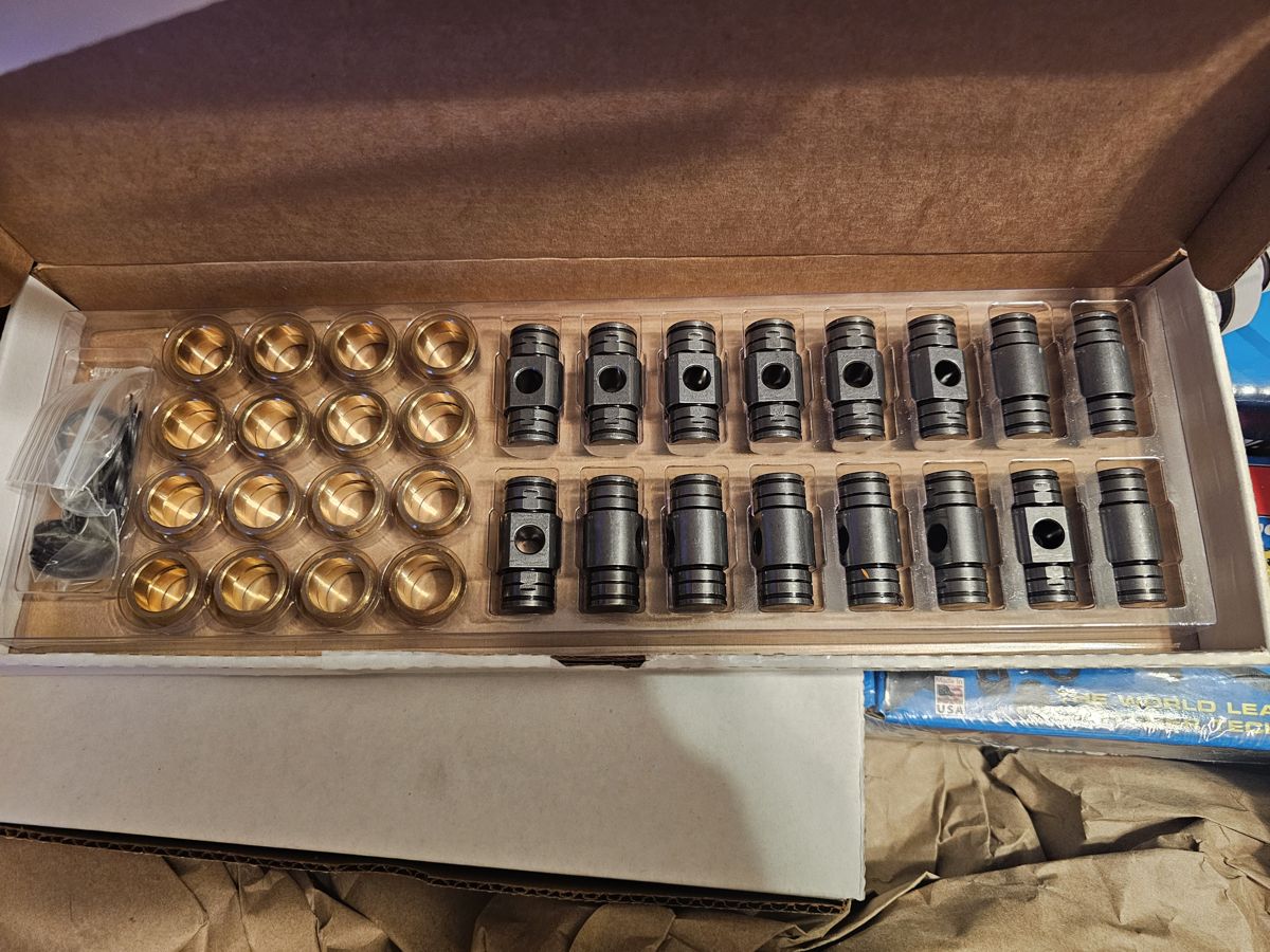Rocker trunnion upgrade kit with bronze bearings in its box
